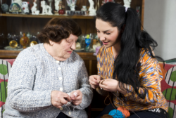 elderly woman with her caregiver doing handy works